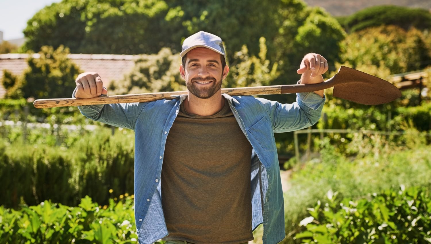 Man, farmer portrait and shovel outdoor, gardening and sustainability project for organic soil. Male person, agriculture and spade for plant harvest in nature, agro confidence and farm for growth.